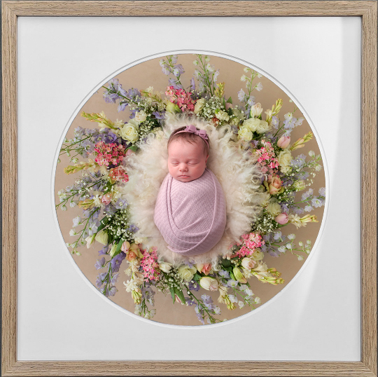 Framed image of a baby girl in a flower wreath. best newborn photographer Taipei photoshoot with boho baby international