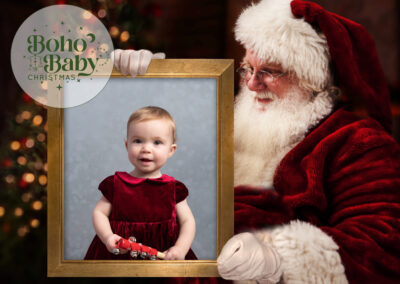 SANTA HOLDS A PHOTO FRAME OF A BABY GIRL IN A CHRISTMAS DRESS FOR A TAIPEI CHRISTMAS PHOTOSHOOT