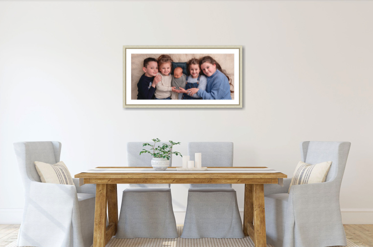 a framed portrait of five siblings hangs over a dining table by newborn photographer taipei Cass Davies at Boho Baby international, TAIPEI PHOTOSHOOT, frame pricing guide image